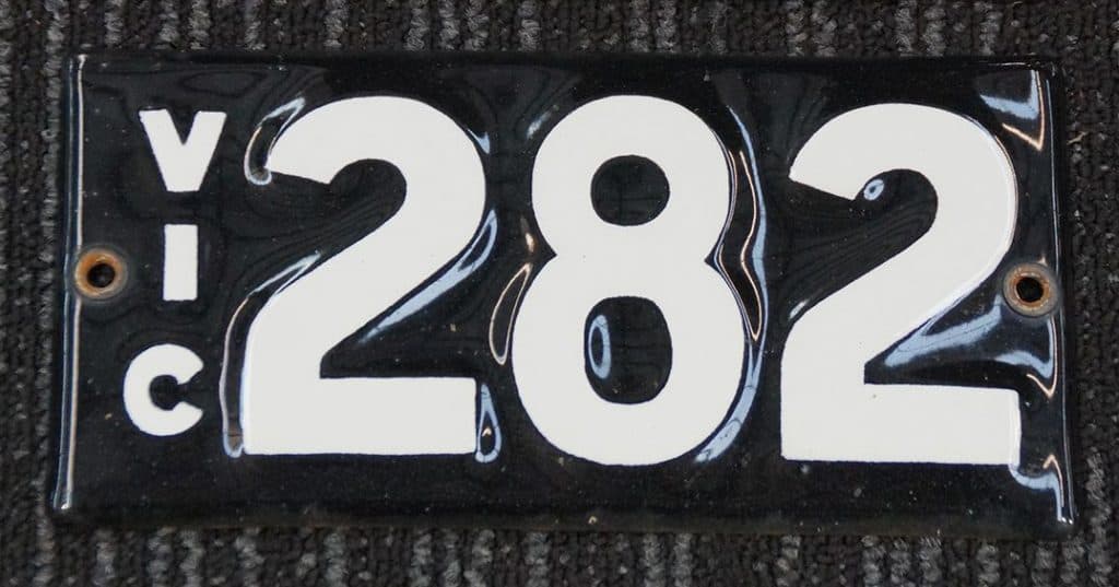 Pair of Victorian heritage number plates showing 888-223 combination in classic black and white, example of custom plates for sale in Australia